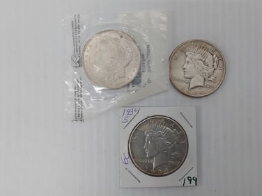 (2) Peace silver dollars and (1) Morgan