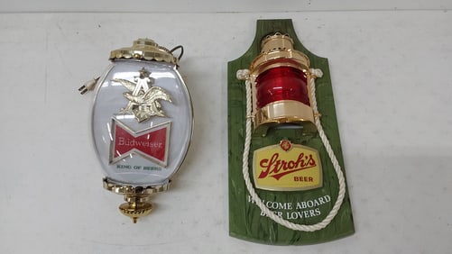 Budweiser light up sign and Stroh's Beer sign