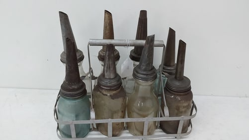 (8) oil bottles with can