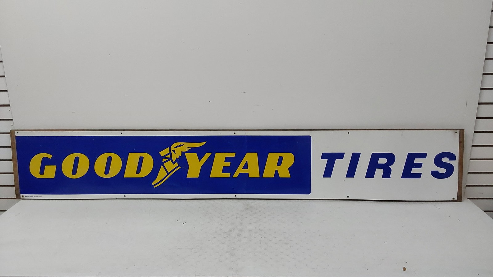 Goodyear Tires aluminum sign mounted on wood: Condition = 8 14 1/2" x 92" NO SHIPPING - PICK UP ONLY