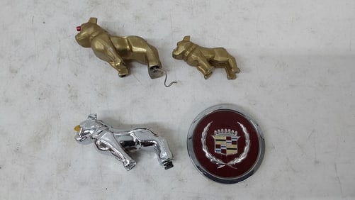 (3) Mack bull dogs and Cadillac emblem
