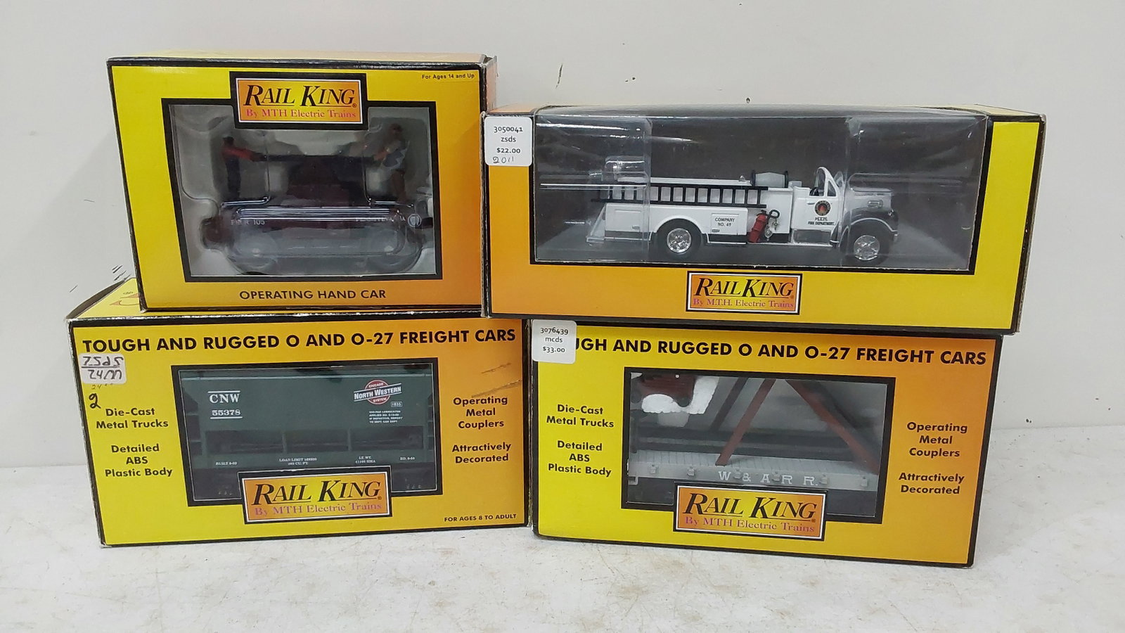 (3) Rail King railroad cars and fire truck: in boxes. 30-7519 30-76439 30-2574 30-2574