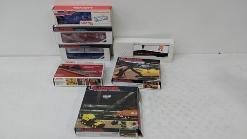 (7) Lionel train cars and accessories with boxes
