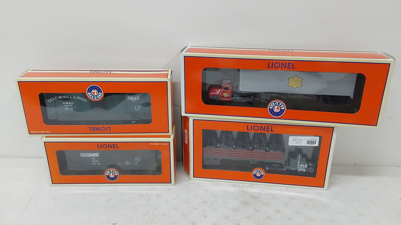 (3) Lionel train cars and (1) tractor trailer: with boxes 6-16482 6-25024 6-37813 6-82847