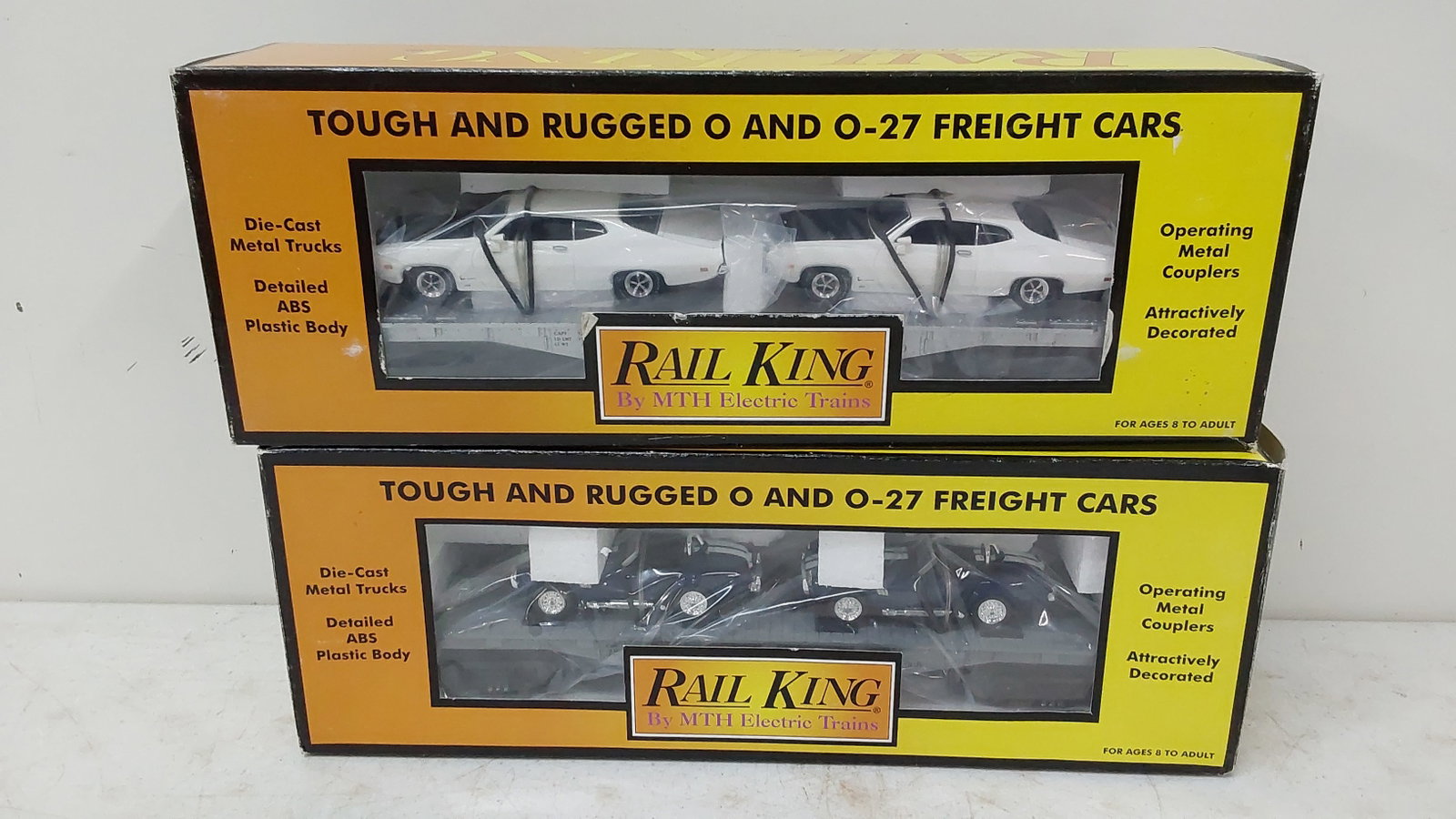 (2) Rail King MTH auto transporters with cars: Boxes included. 30-7692 and 30-7660