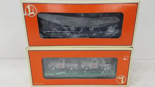 (2) Lionel train cars with trucks and cars