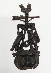 early cast iron match holder with hunting scene