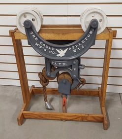 The Eagle Mfg. Co. hay trolley on wood stand