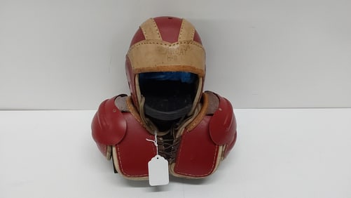 vintage child's football helmet and pads w/stand