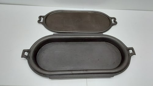 (2) unmarked cast iron griddles