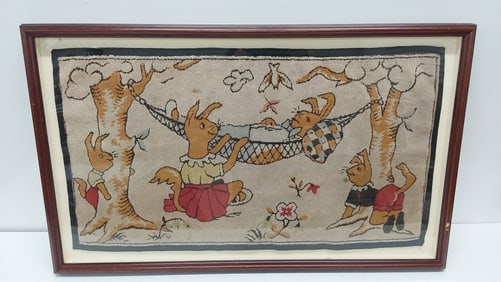 framed hand made rug featuring rabbits