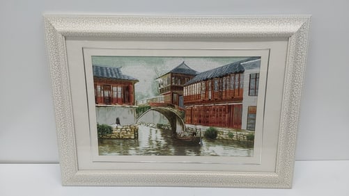 framed embroidery with canal scene