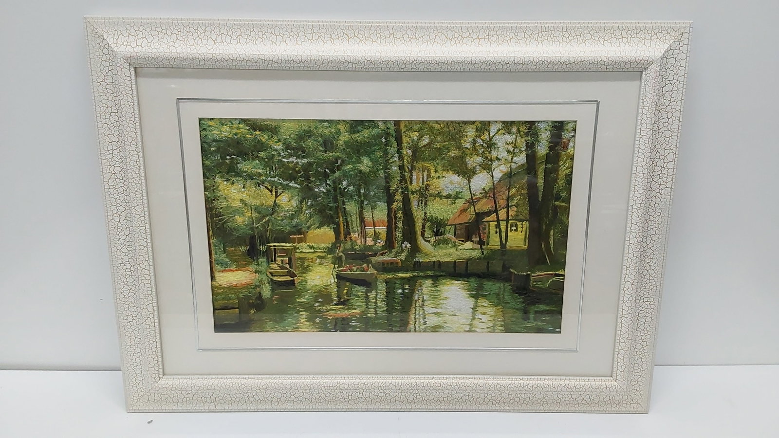 embroidered river front house scene: 25" x 34 1/2"