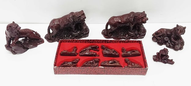 (12) Red resin tiger statuettes and (1) monkey
