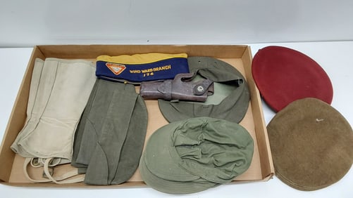 flat of USMC hats and holster