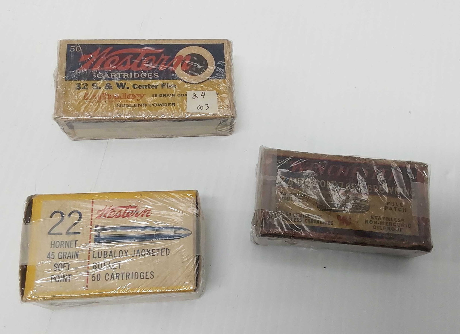 (3) vintage ammunition boxes: Western .22 partial box, Western 32 S&W full box, Winchester .32 auto Colt parital box and end flap is missing.