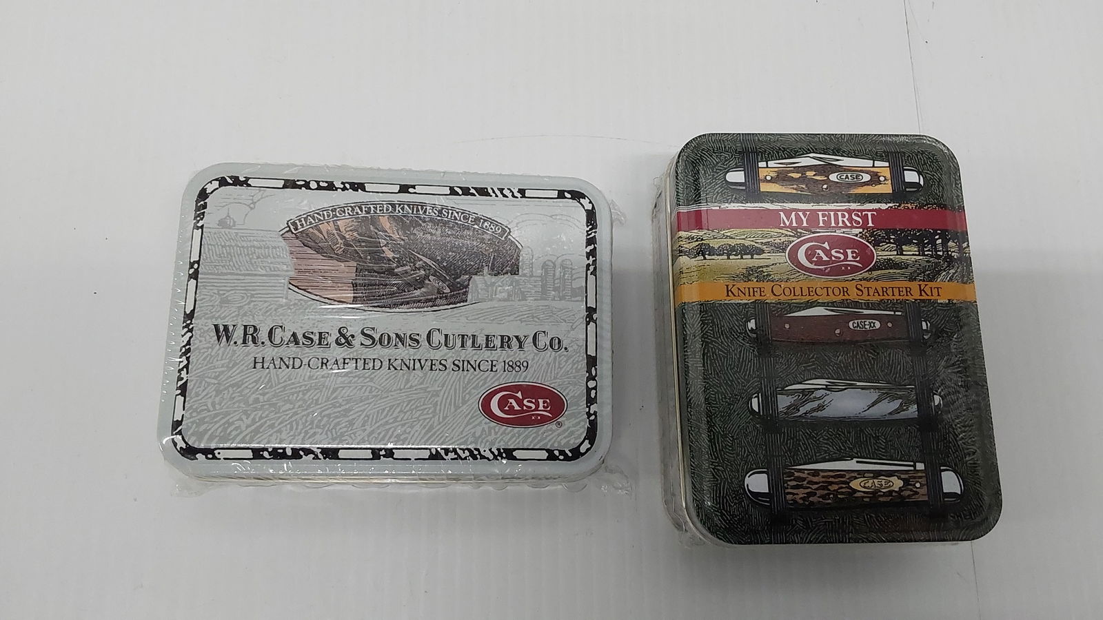 (2) factory sealed Case XX knives in tins: (2) factory sealed Case XX knives in tins