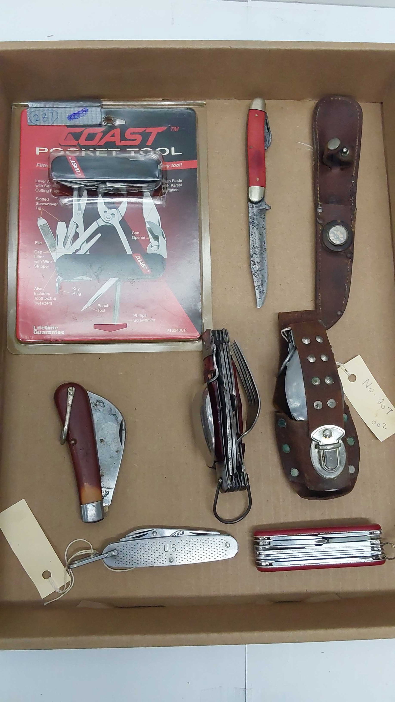 flat with (7) various knives: (1) US military pocket knife (2) Camper's knives