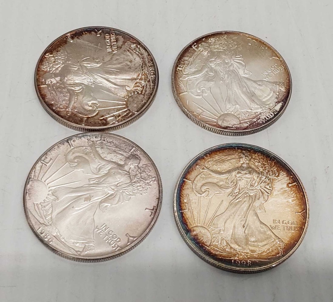 (4) silver Eagles: 1986, 1988, 1998 and 2002