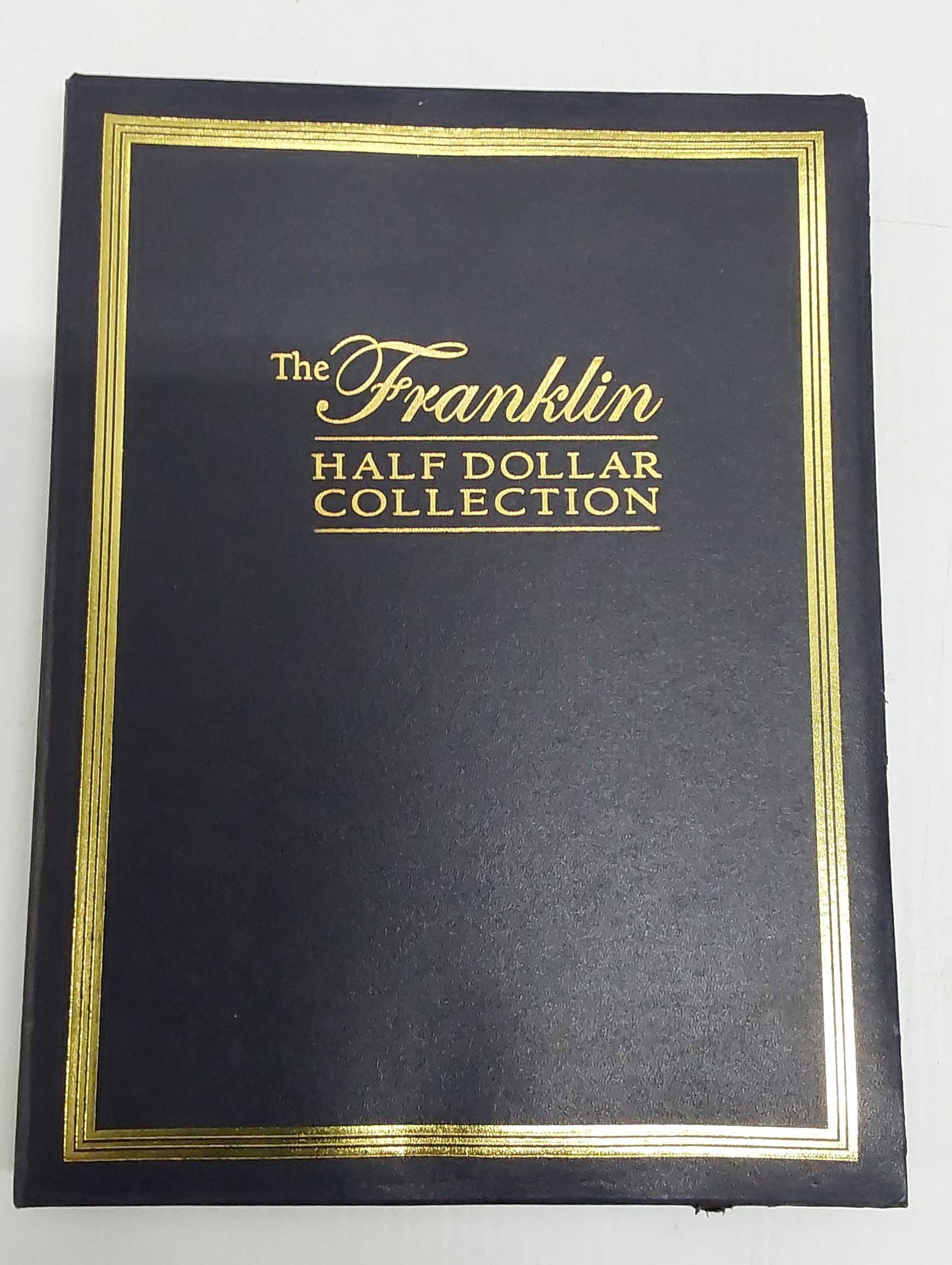(28) various Ben Franklin silver halves in book: (28) various Ben Franklin silver halves in book
