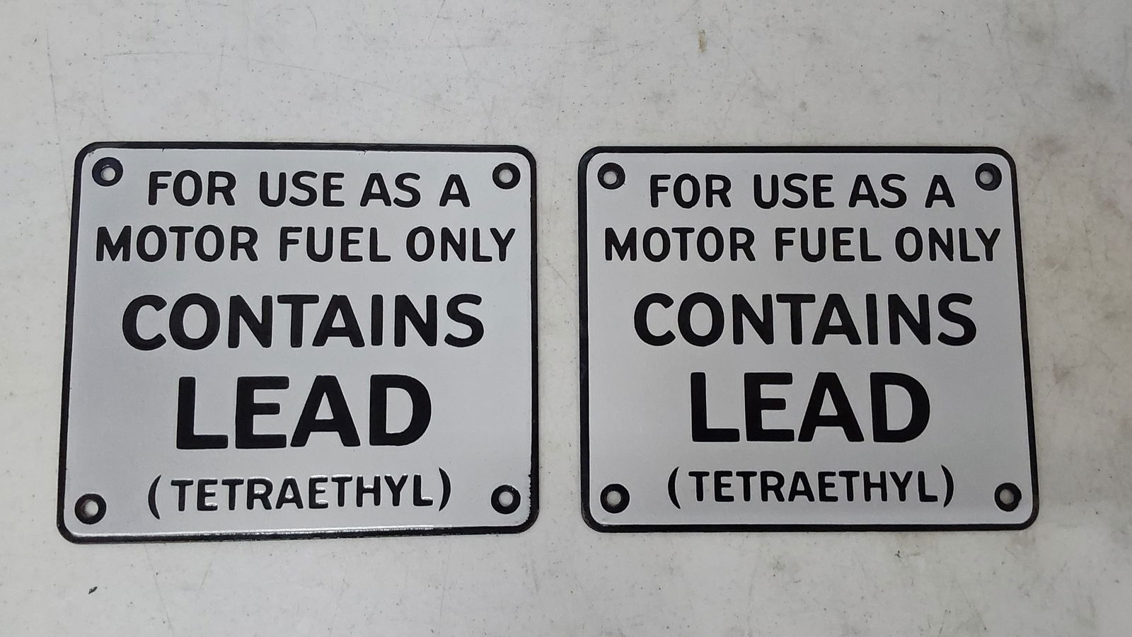 (2) NOS porcelain "Contains Lead" signs (1 of 2)