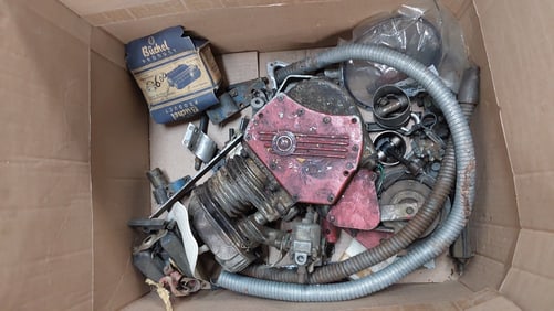 box of Whizzer motorized bike parts
