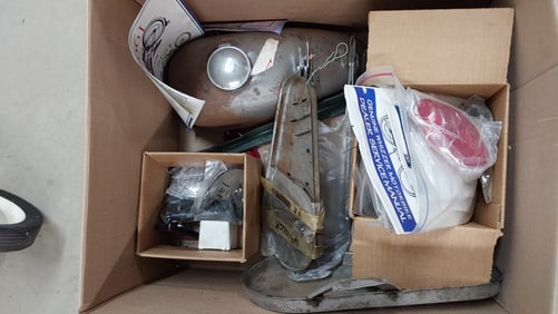box of Whizzer motorized bike parts