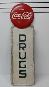 Coca-Cola button above Drug store SST sign