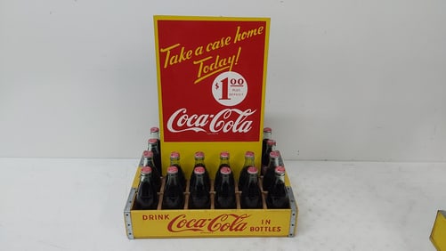 crate of Coca-Cola bottles w/masonite advertising