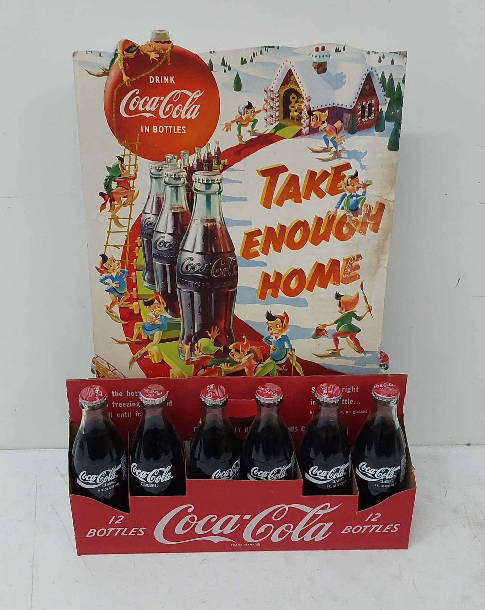 12-pack of Coca-Cola bottles w/cardboard sign (1 of 1)