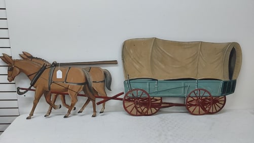 team of mules pulling covered wagon