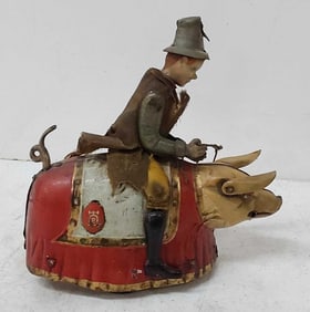 Lehmann man riding the pig wind up toy