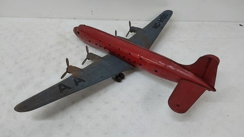 metal toy airplane with wood wheels