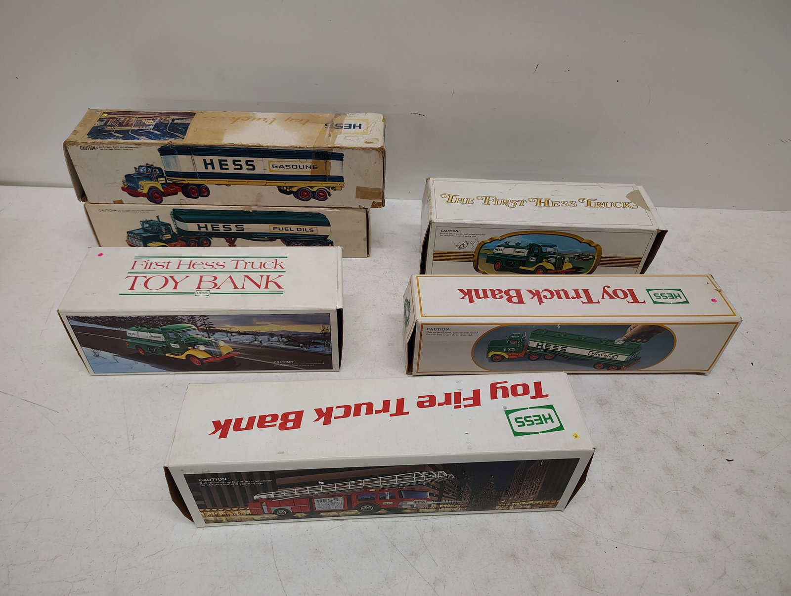 toys: 6 older Hess trucks in boxes