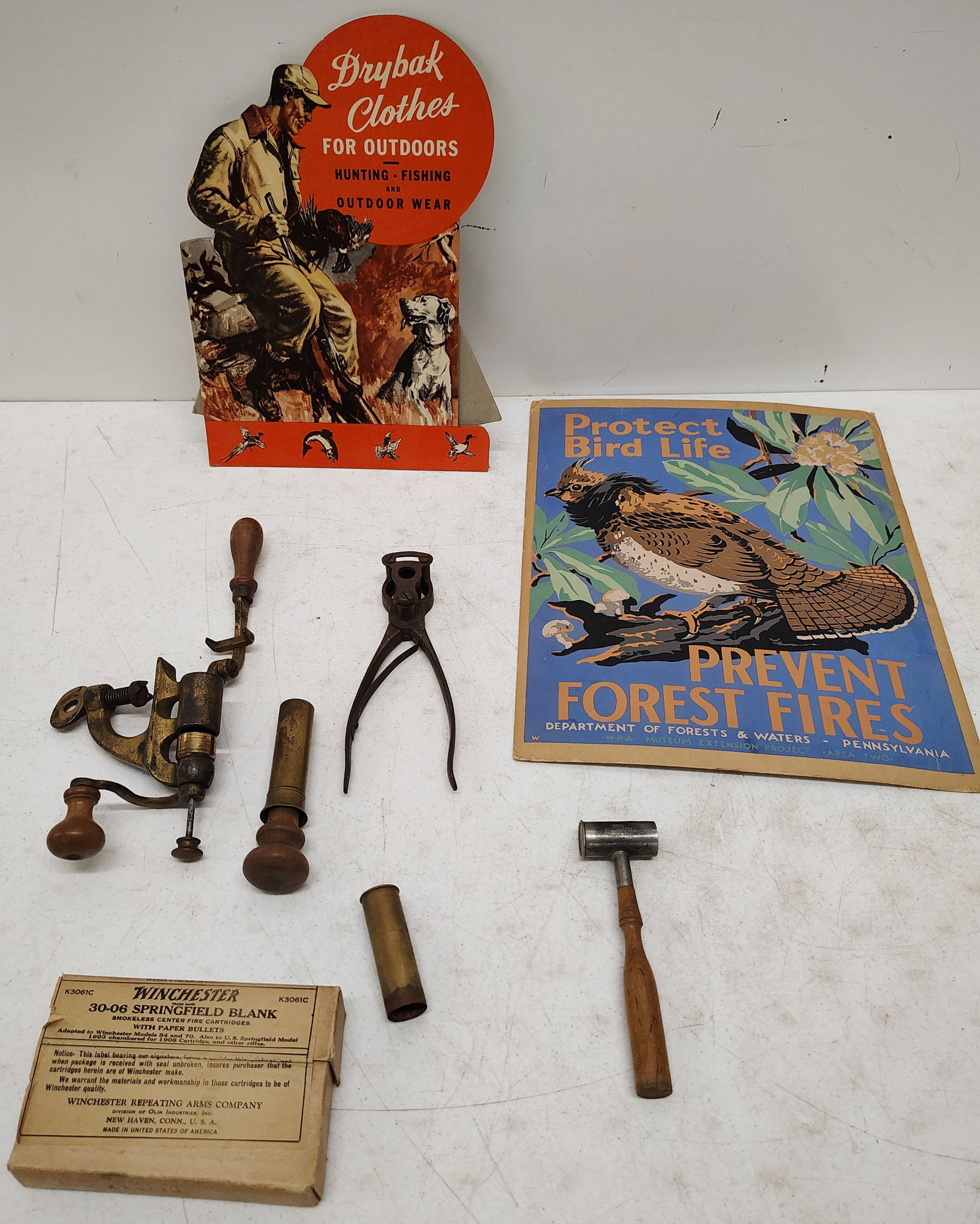 sports lot: Drybak clothes display, "Protect Bird Life Prevent Forest Fires poster, shell reloader, full box of 30-06 bullets blanks