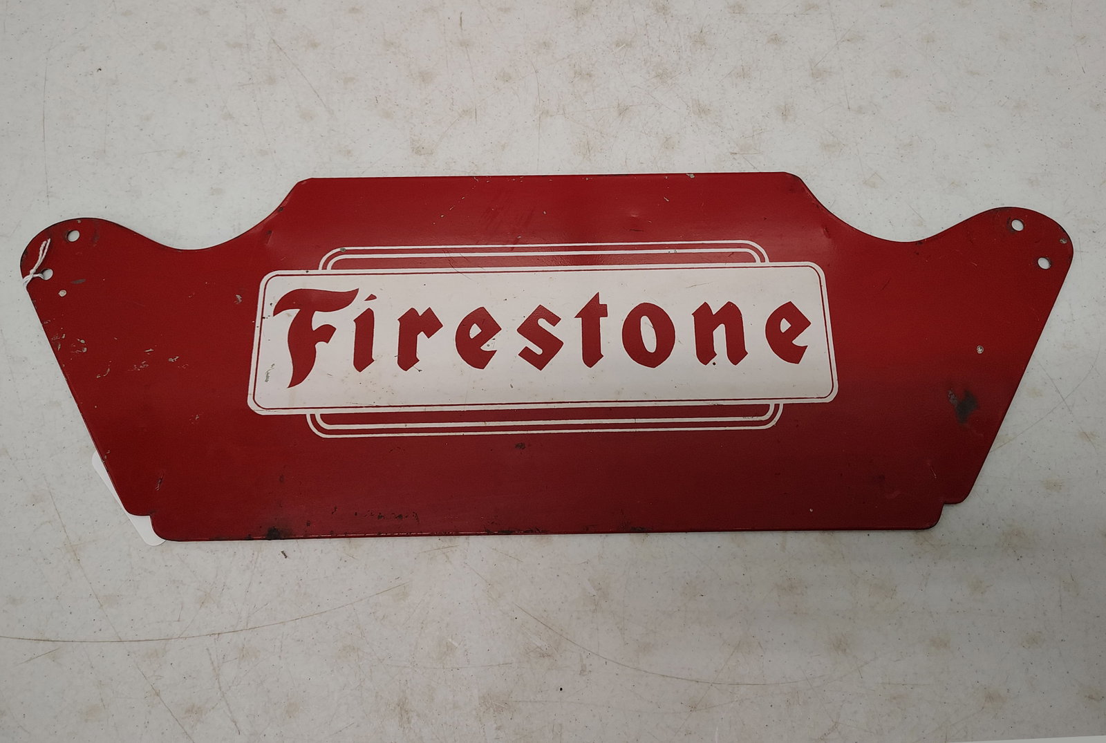tire stand item: part of a Firestone tire stand