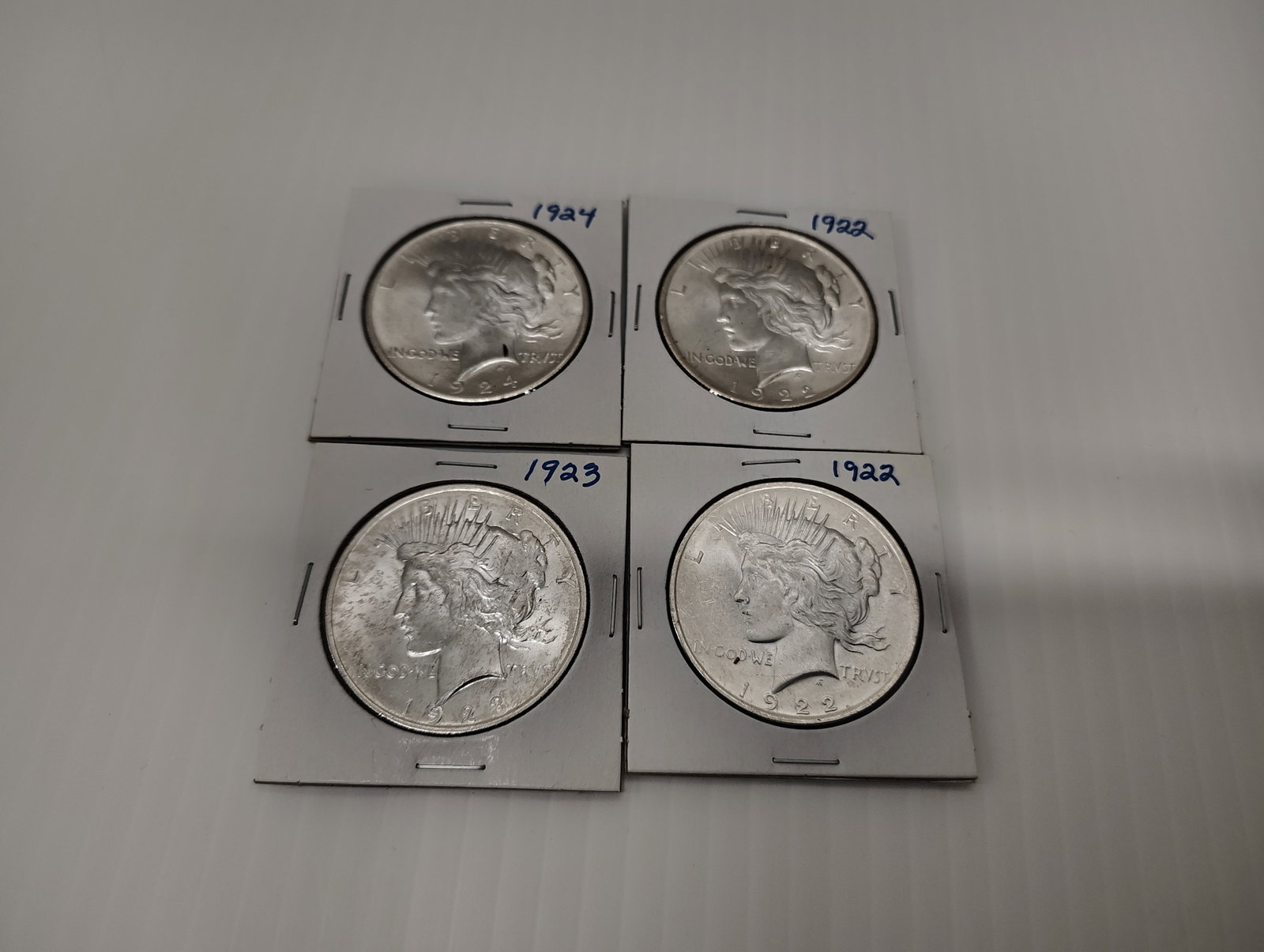 coins: silver Peace dollars (2) 1922, 1923 and 1924