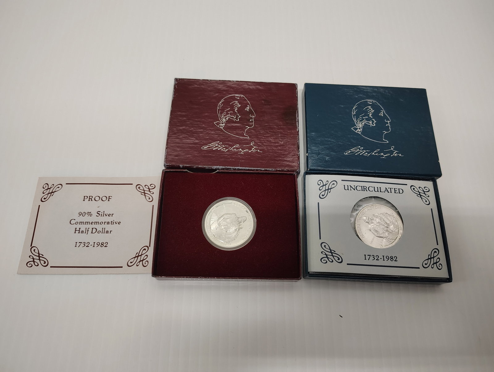 coins: (2) 90% silver half dollar 1732-1982 George Washington