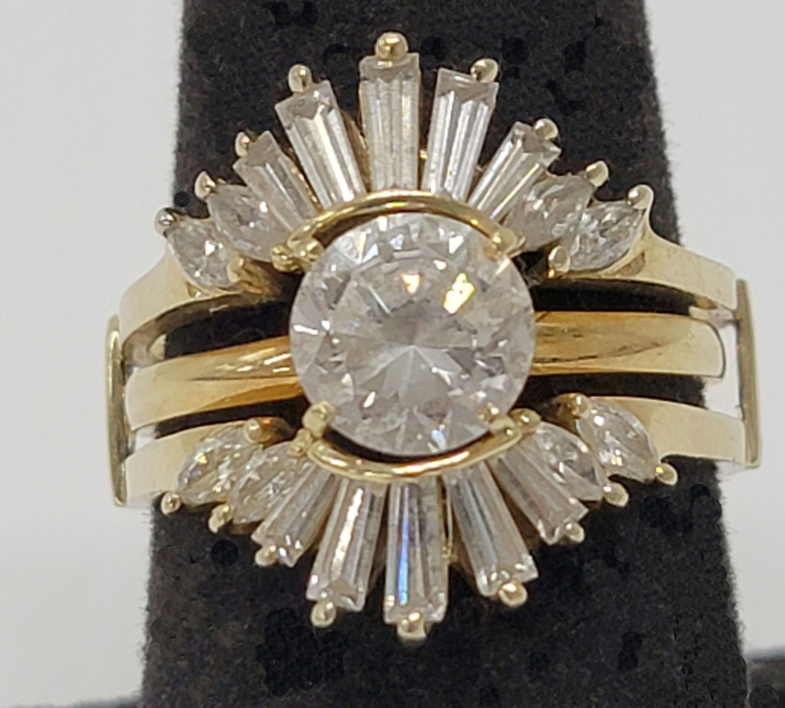 jewelry: 10k diamond wedding ring set, 7 grams Approximately size 10 Center stone is approximately 8mm diameter. Wedding band enhancer has 18 stones.