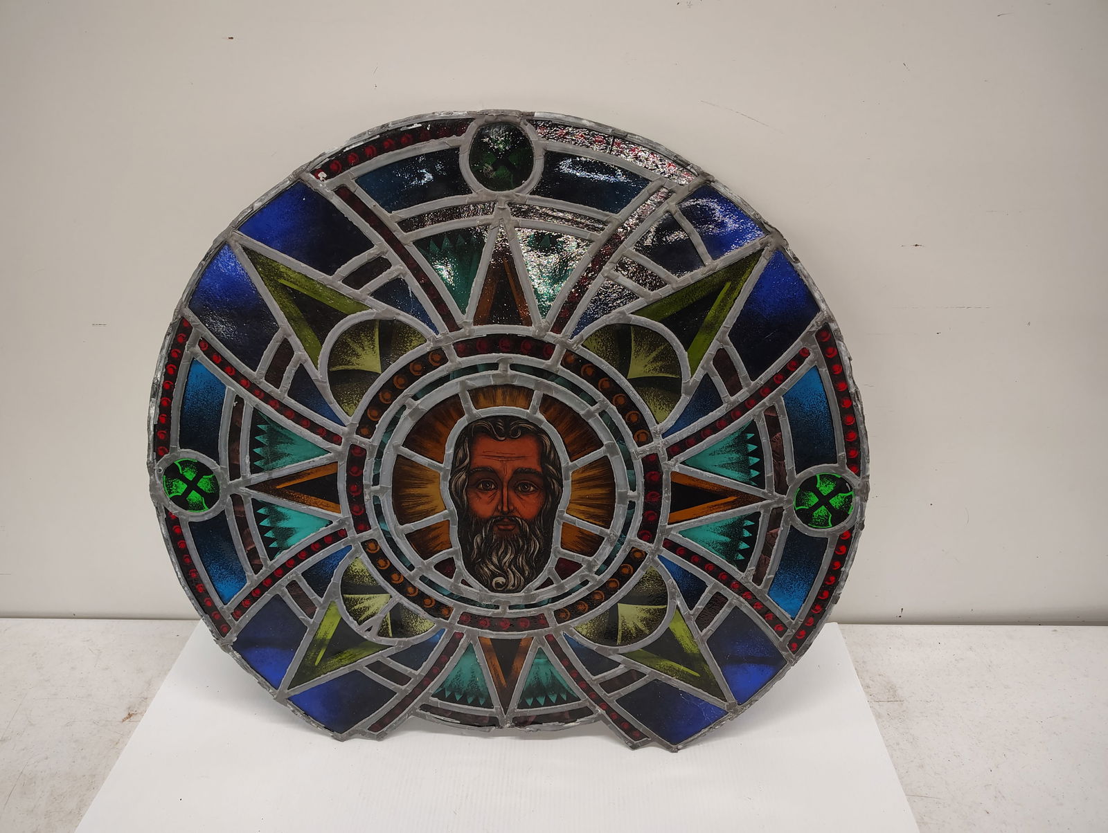 window: leaded stain glass window out of a church has a very slight crack 31 diameter