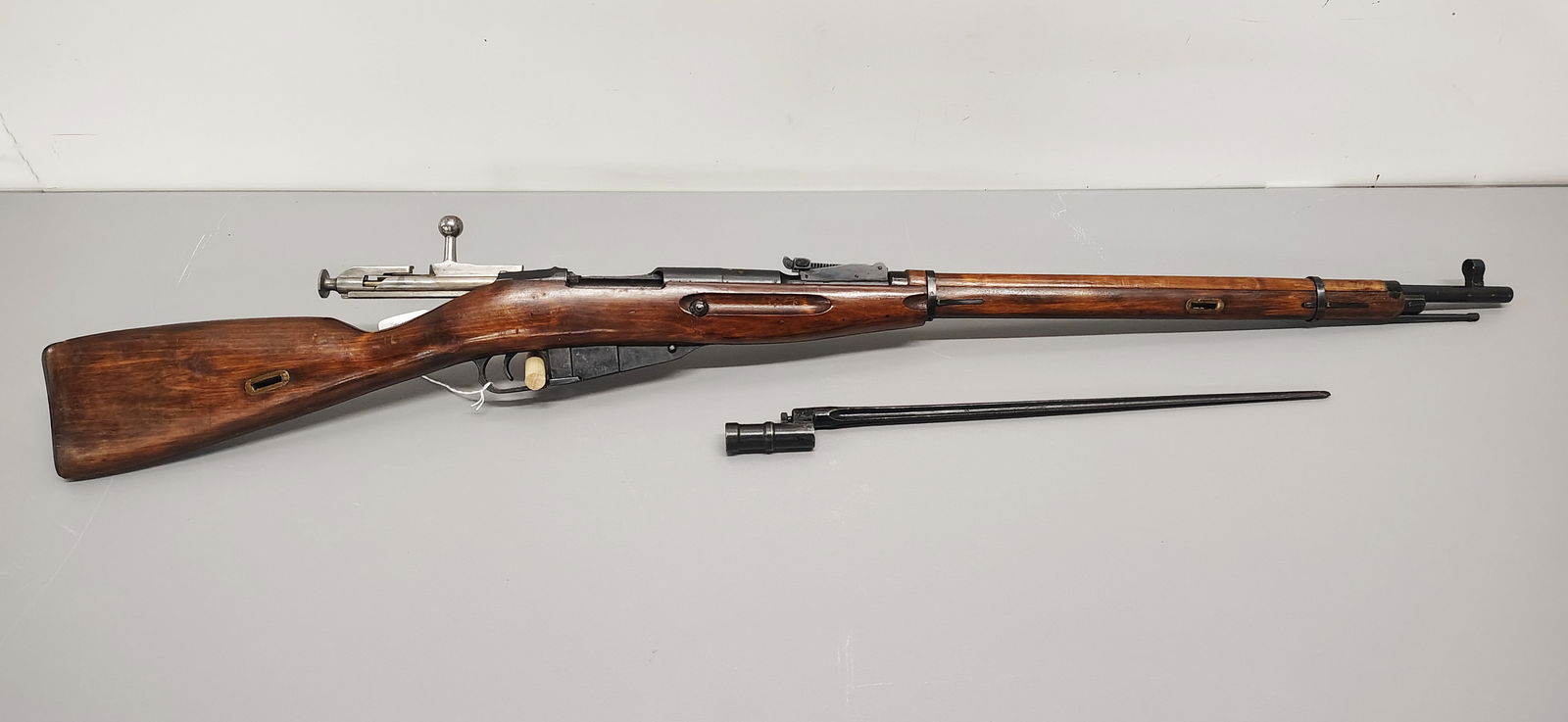 Gun: soviet mosin nagant 7.62 caliber? serial number: AH 1272 with a bayonet