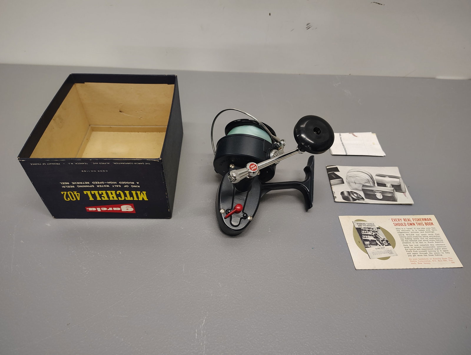 Fishing items: Garcia mitchell 402 salt water looks like it has never been used half of the box
