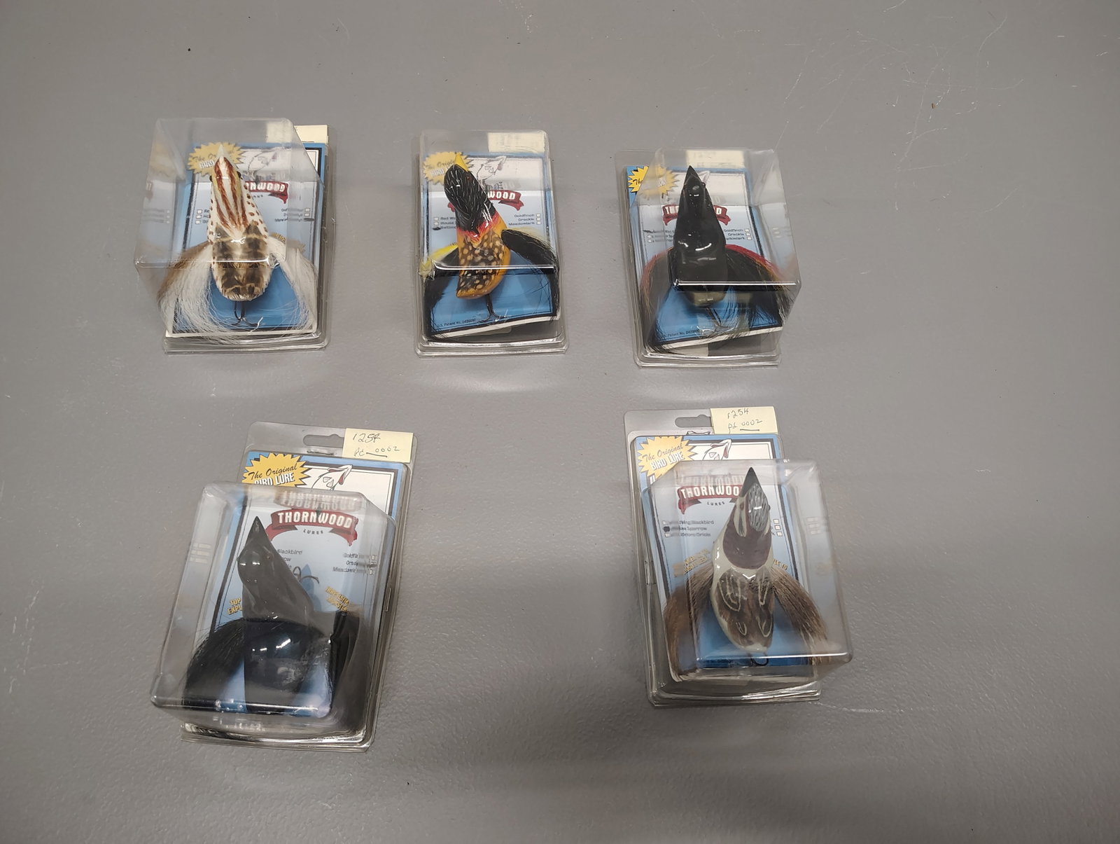 Fishing items: 5 bird lures in original boxes