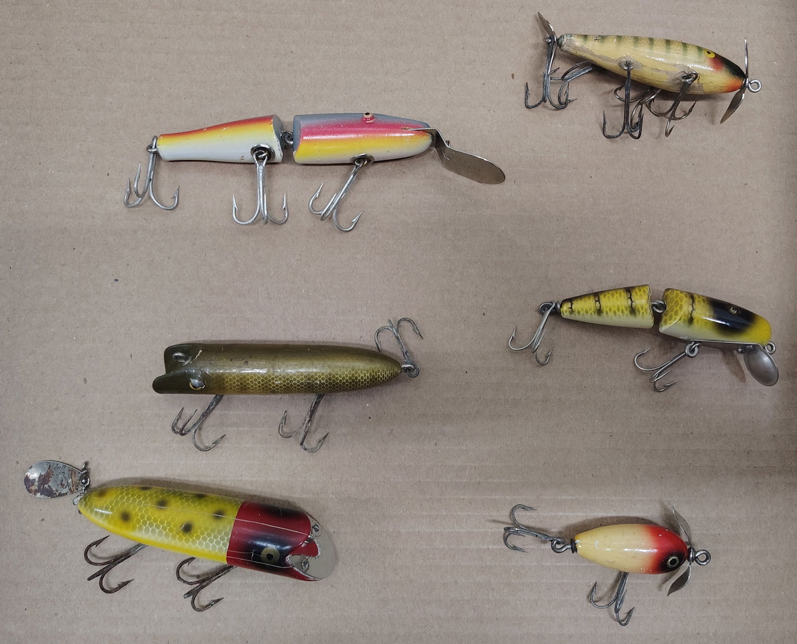 Fishing items: Believed to be abbey and imbrie wooden 5 hook 2 jointed creek chubs south bend-bass oreno shakespeare midget wooden lure