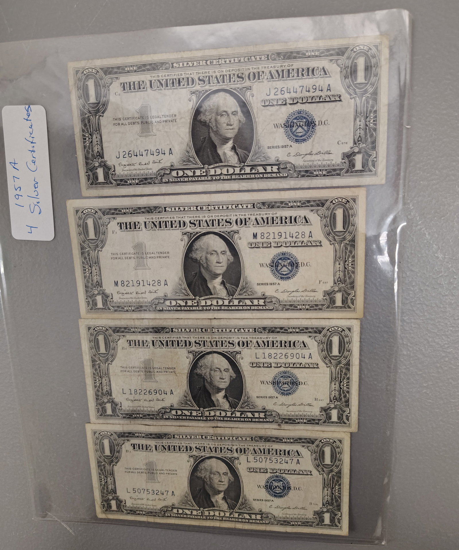 Coins: 4 1957 A silver certificates