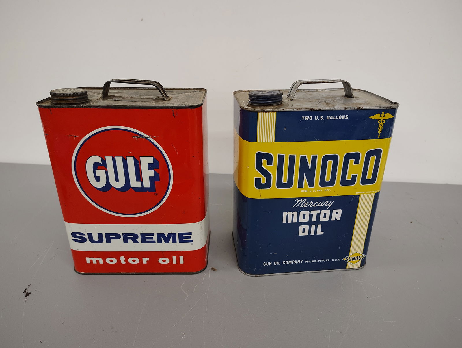 oil cans: Sunoco and Gulf Supreme 2-gallon oil cans