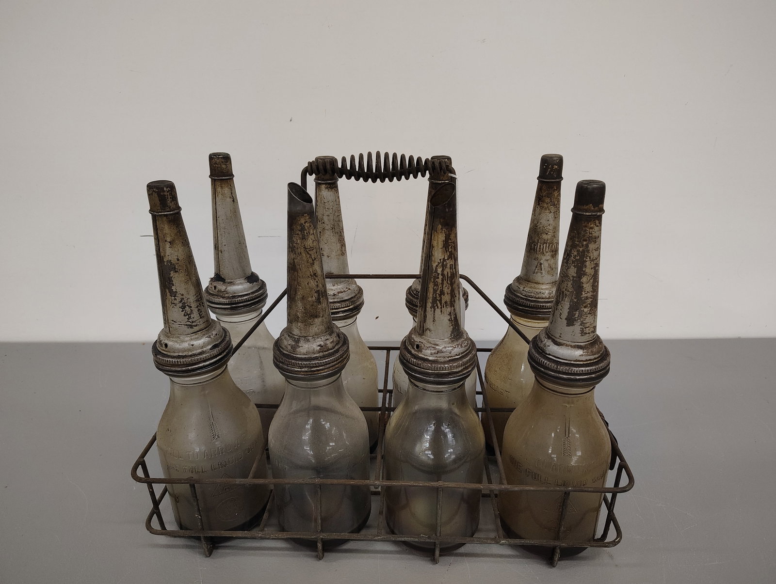 oil bottles in carrier: (8) oil bottles in wire carrier