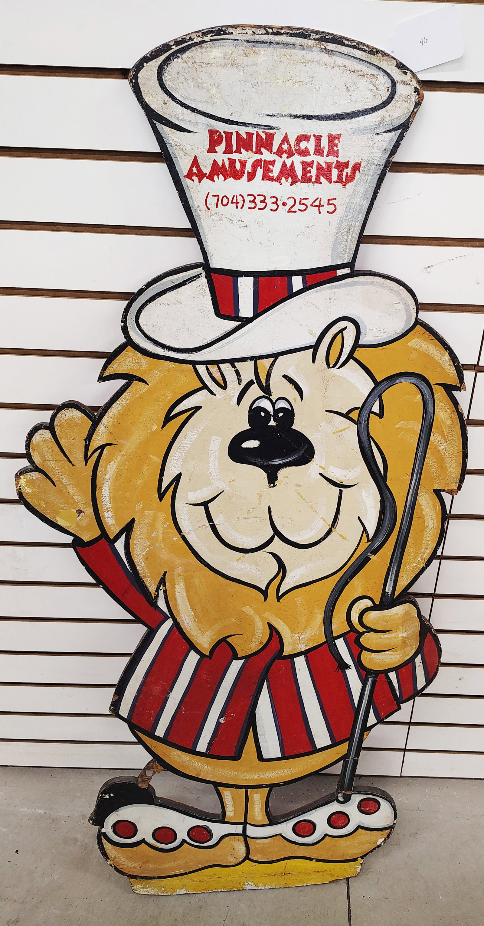 Sign: Pinnacle Amusement park lion made out of plywood