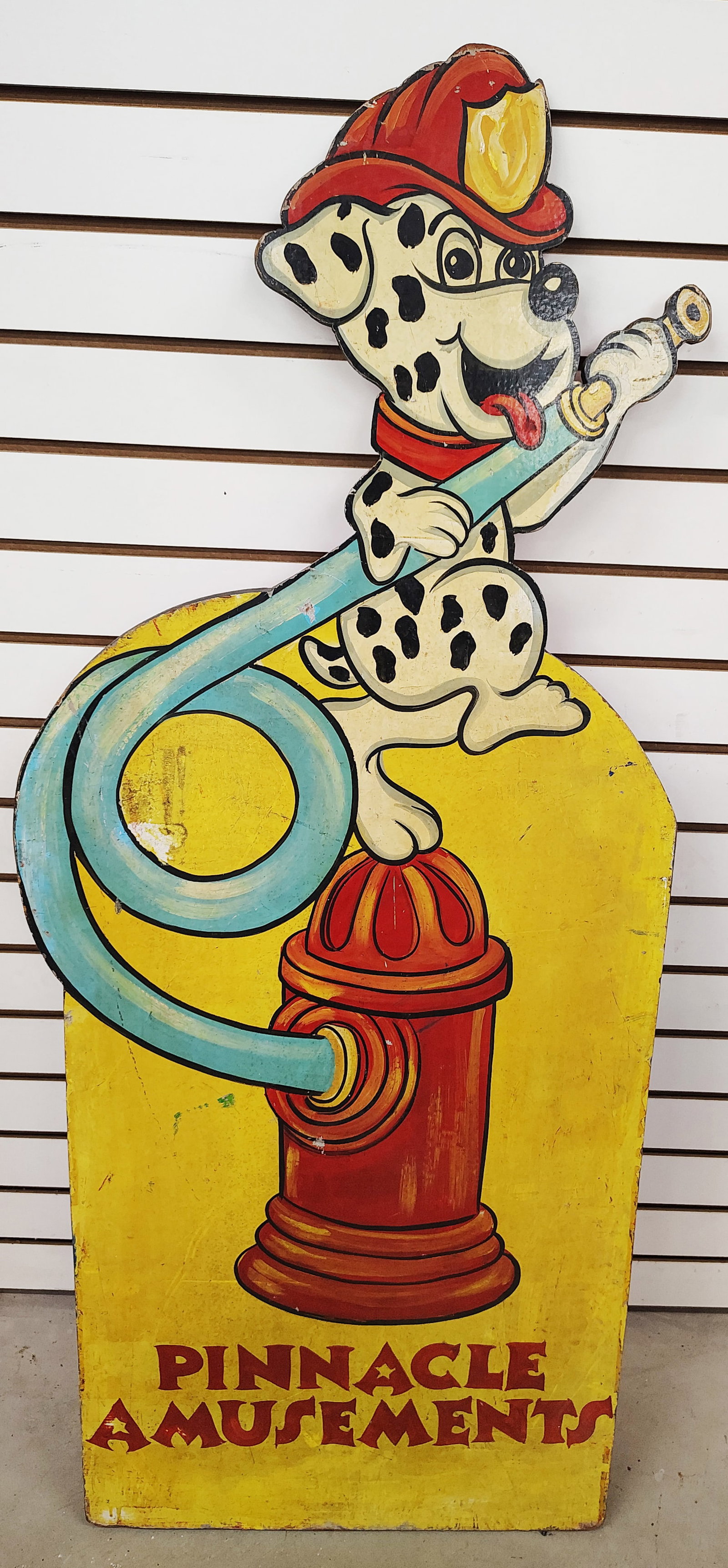 Sign: Pinnacle amusement made of plywood