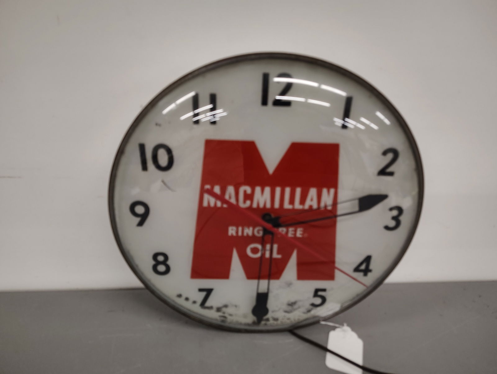 Clock: Macmillian Oil clock It lights up and works